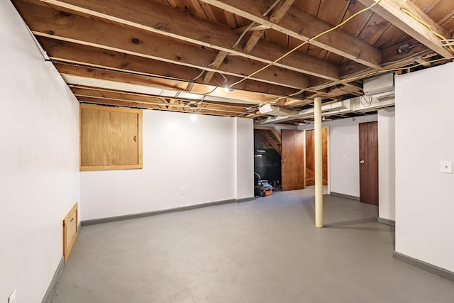 finished basement featuring baseboards
