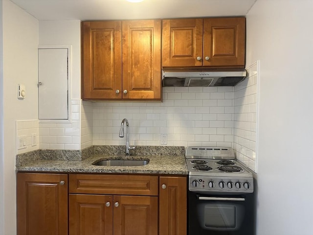 994 Washington St Unit 2, Weymouth, MA 02189 - kitchen featuring electric stove, under cabinet range hood, a sink, brown cabinets, and decorative backsplash
