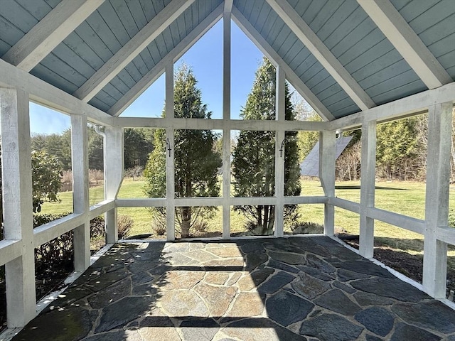 sunroom featuring beamed ceiling