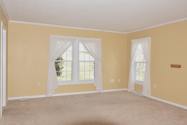 unfurnished room with crown molding, light colored carpet, and baseboards