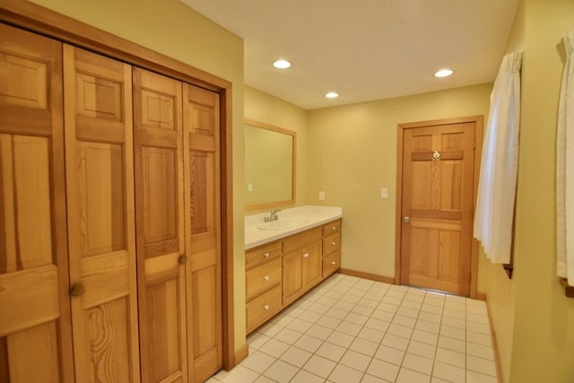 full bath with tile patterned floors, recessed lighting, baseboards, and vanity