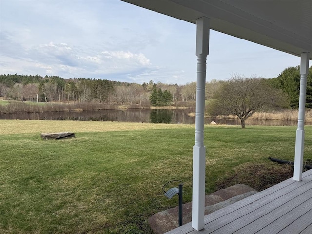 view of yard with fence and a water view