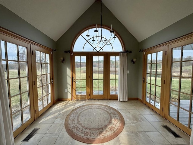 doorway to outside featuring a wealth of natural light and visible vents