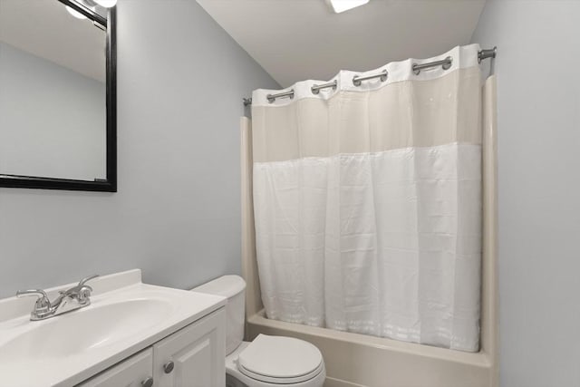 full bathroom with shower / tub combo, vanity, and toilet