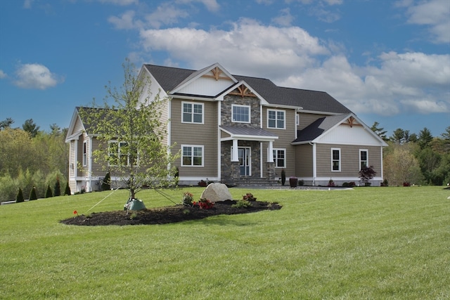 craftsman-style house featuring a front yard