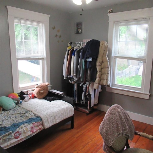 85-87 Belrose Ave, Lowell, MA 01852 - bedroom with multiple windows and wood finished floors