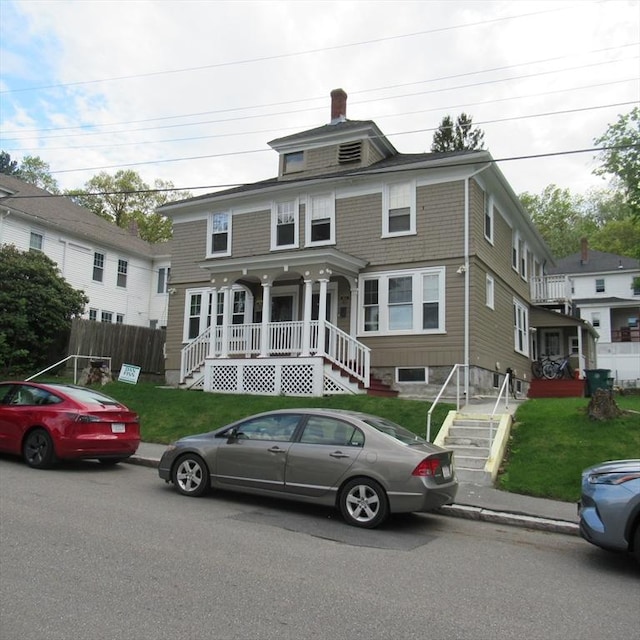85-87 Belrose Ave, Lowell, MA 01852 - traditional style home featuring covered porch, stairs, and a chimney