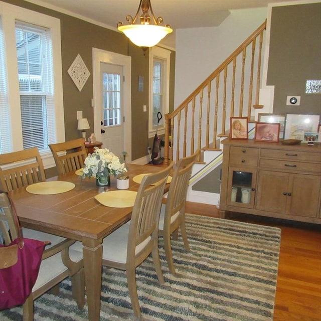 85-87 Belrose Ave, Lowell, MA 01852 - dining space with stairs, wood finished floors, and ornamental molding