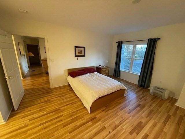 bedroom featuring light wood finished floors
