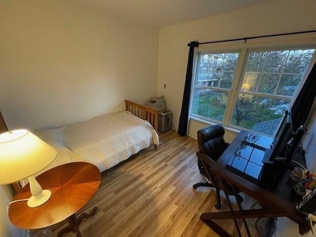 bedroom featuring light wood-style flooring