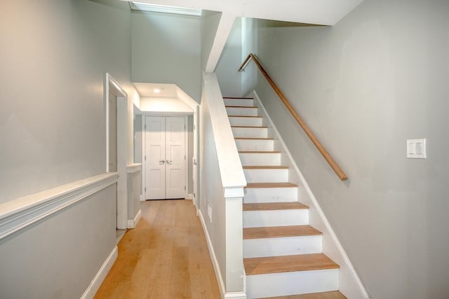 stairway featuring wood-type flooring