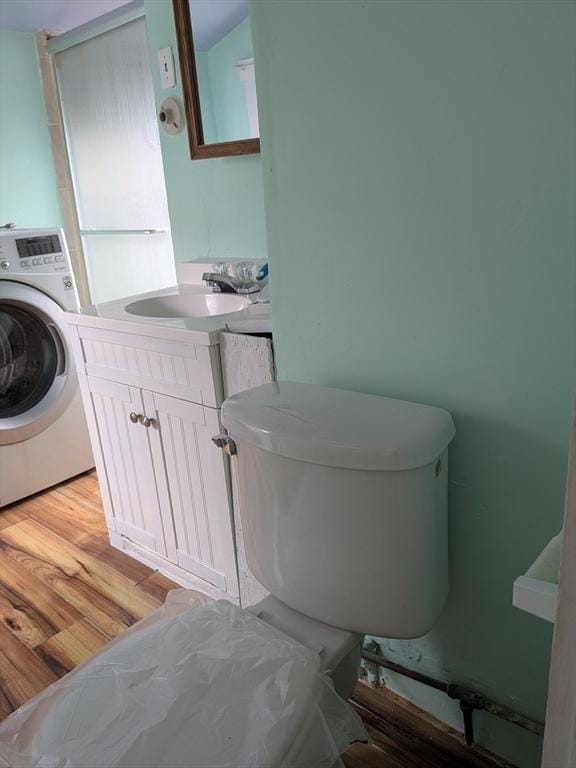 15 10th, Lowell, MA 01850 - bathroom with washer / dryer, vanity, and wood finished floors