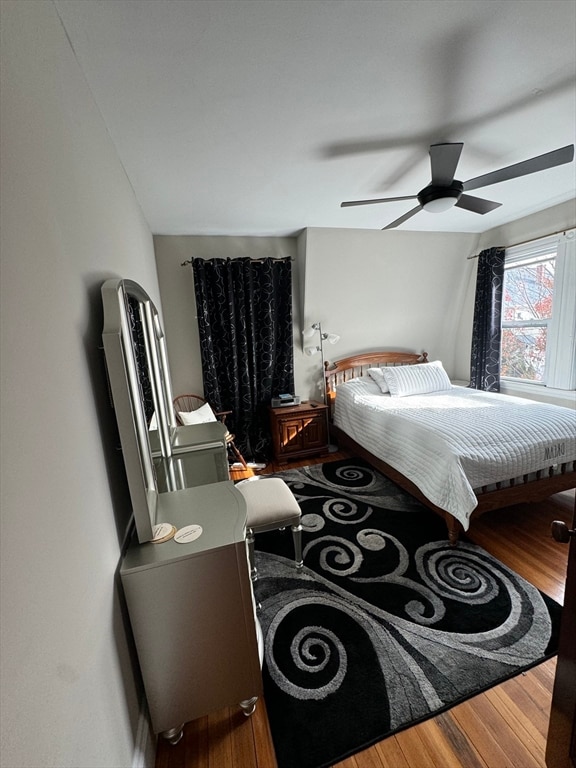 bedroom featuring hardwood / wood-style flooring and ceiling fan