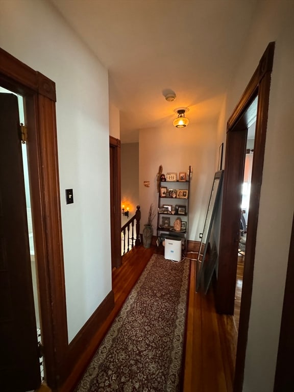 hallway featuring dark hardwood / wood-style floors