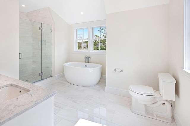 1 Wilsons Ln, Edgartown, MA 02539 - bathroom featuring a freestanding tub, vanity, a stall shower, toilet, and baseboards