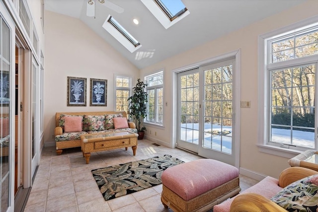 interior space featuring lofted ceiling with skylight and visible vents