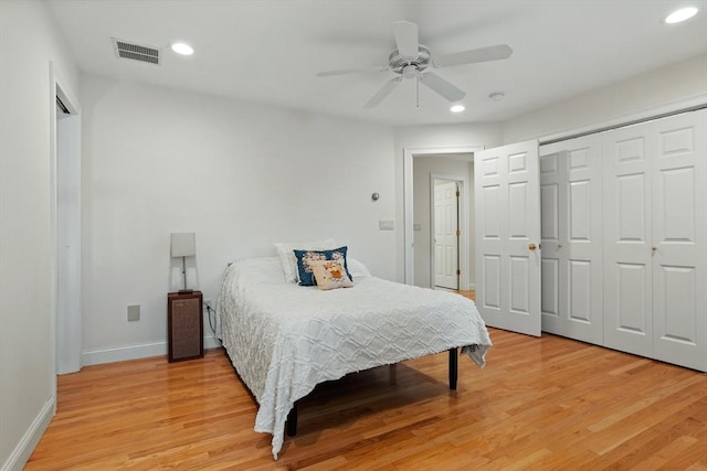 bedroom with light wood-style floors, baseboards, visible vents, and recessed lighting