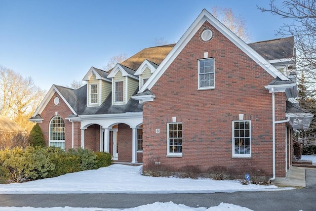 view of front of property featuring brick siding