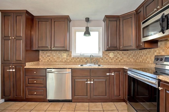 19 Crystal Way Unit 19, Bellingham, MA 02019 - kitchen with appliances with stainless steel finishes, a sink, tasteful backsplash, and light countertops