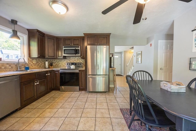 19 Crystal Way Unit 19, Bellingham, MA 02019 - kitchen featuring stainless steel appliances, a sink, tasteful backsplash, and light countertops