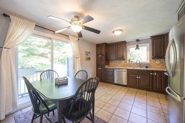 19 Crystal Way Unit 19, Bellingham, MA 02019 - kitchen featuring appliances with stainless steel finishes, a sink, light countertops, a ceiling fan, and backsplash