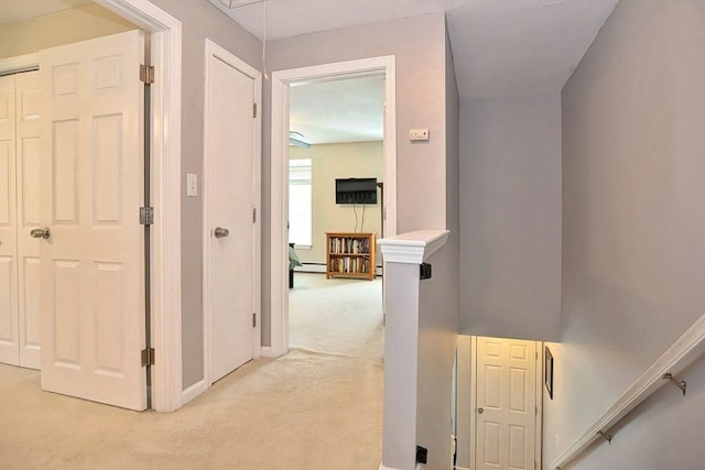 19 Crystal Way Unit 19, Bellingham, MA 02019 - hallway with light carpet, an upstairs landing, attic access, and baseboards