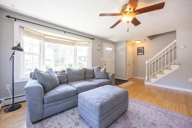19 Crystal Way Unit 19, Bellingham, MA 02019 - living room with light wood-style floors, stairway, ceiling fan, baseboards, and baseboard heating