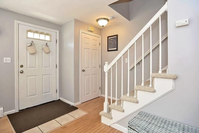 19 Crystal Way Unit 19, Bellingham, MA 02019 - foyer entrance with hardwood / wood-style floors, stairs, and baseboards
