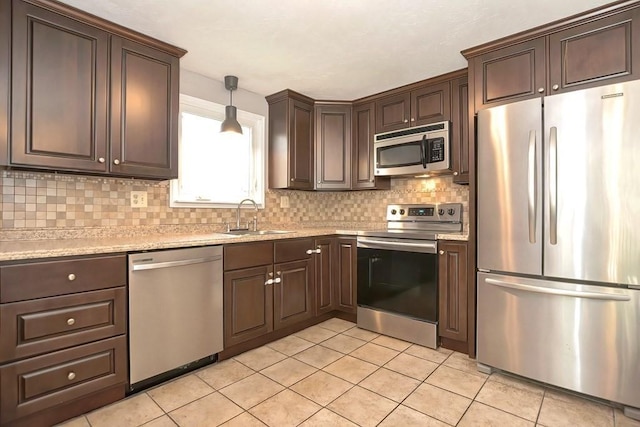 19 Crystal Way Unit 19, Bellingham, MA 02019 - kitchen featuring appliances with stainless steel finishes, a sink, backsplash, and light tile patterned floors