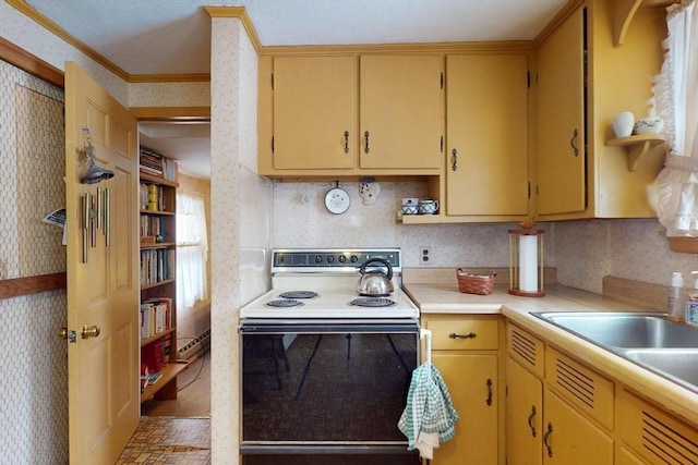 kitchen featuring light countertops, electric range oven, ornamental molding, a sink, and wallpapered walls