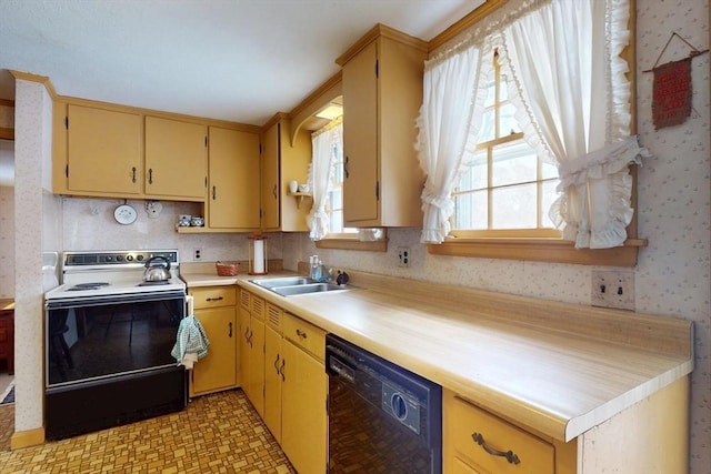 kitchen featuring range with electric cooktop, a sink, black dishwasher, light countertops, and wallpapered walls