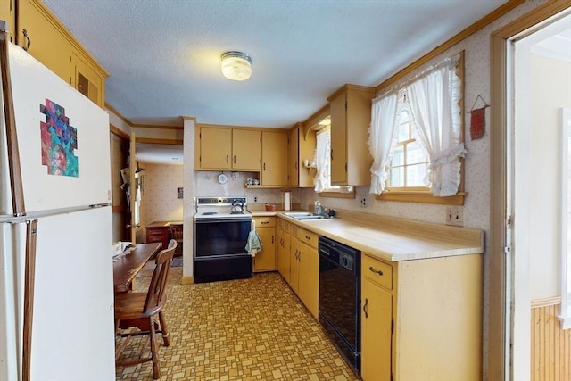 kitchen featuring wallpapered walls, black dishwasher, range with electric stovetop, and freestanding refrigerator