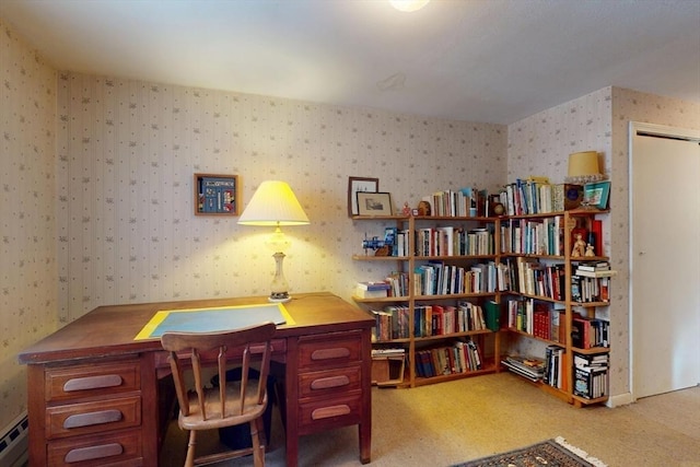 carpeted home office with a baseboard heating unit and wallpapered walls