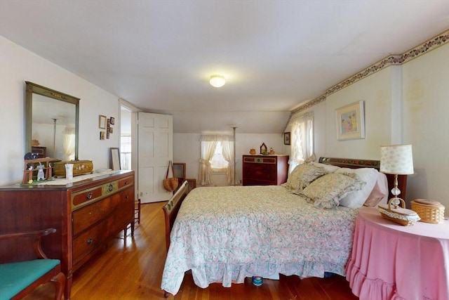 bedroom featuring wood finished floors