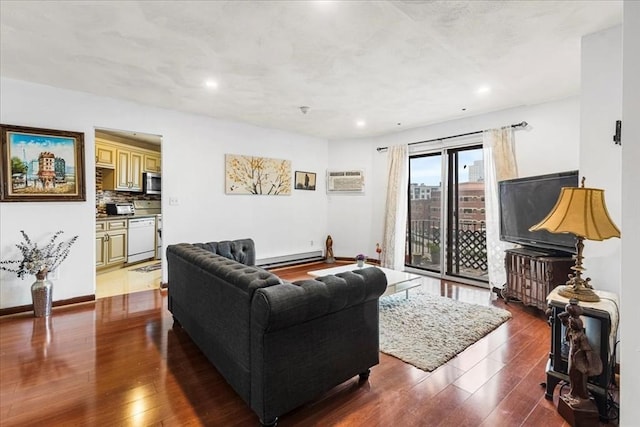 living room featuring baseboard heating, hardwood / wood-style flooring, recessed lighting, a wall unit AC, and baseboards