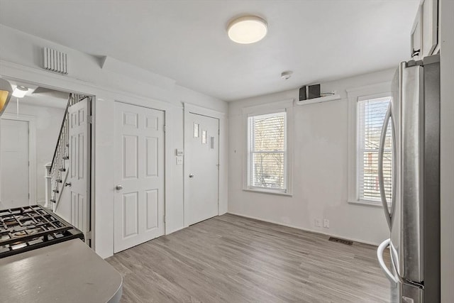 foyer with light wood-type flooring