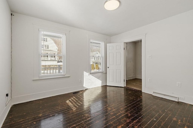 unfurnished room featuring dark hardwood / wood-style flooring