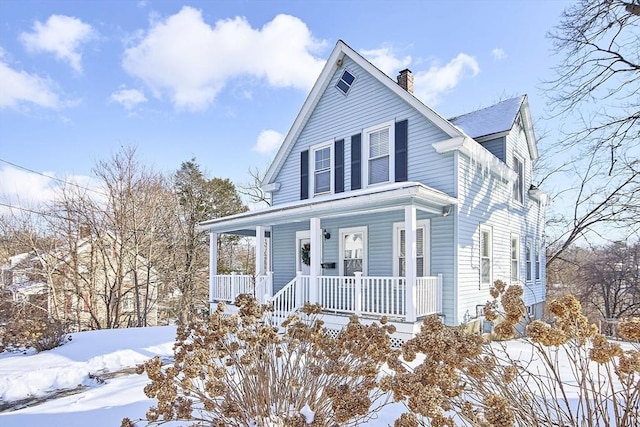 country-style home featuring a porch