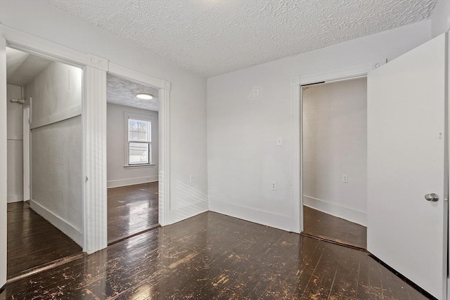 spare room with a textured ceiling