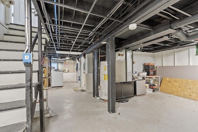 basement featuring washer / clothes dryer and gas water heater