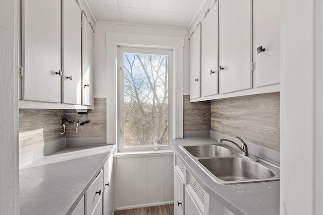 kitchen with sink and white cabinets