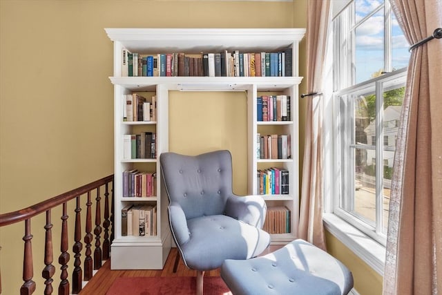 sitting room featuring wood finished floors