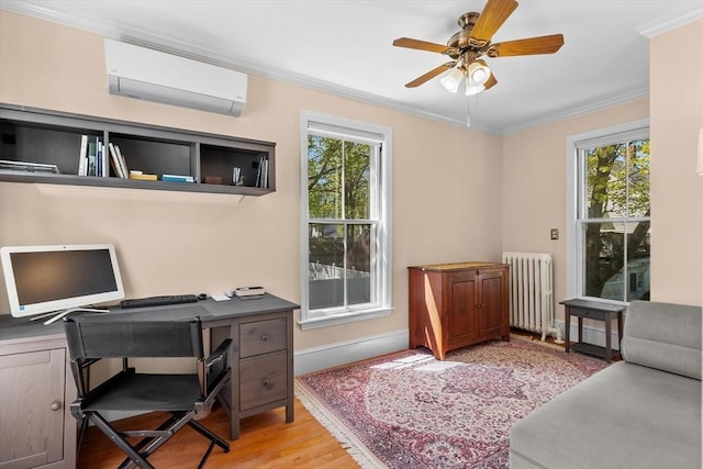 office area featuring radiator, ornamental molding, a healthy amount of sunlight, and a wall unit AC