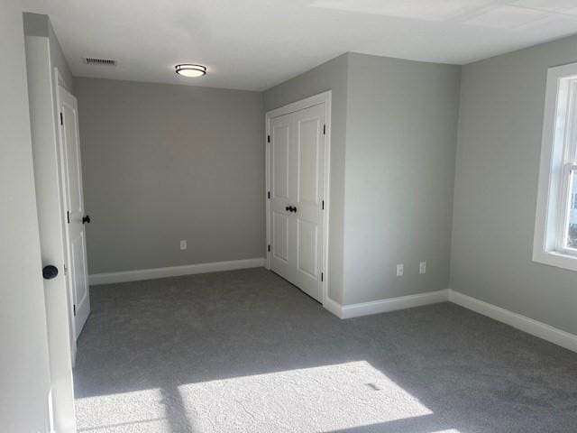 spare room with light carpet