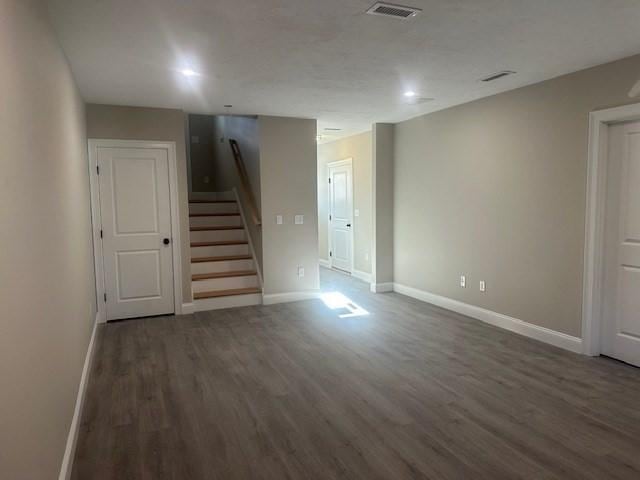 interior space with dark hardwood / wood-style flooring