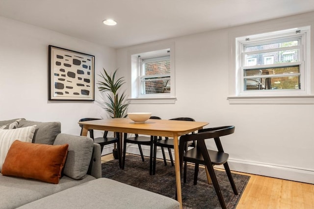 dining room with dark hardwood / wood-style flooring