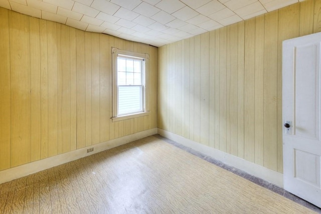 empty room with wooden walls