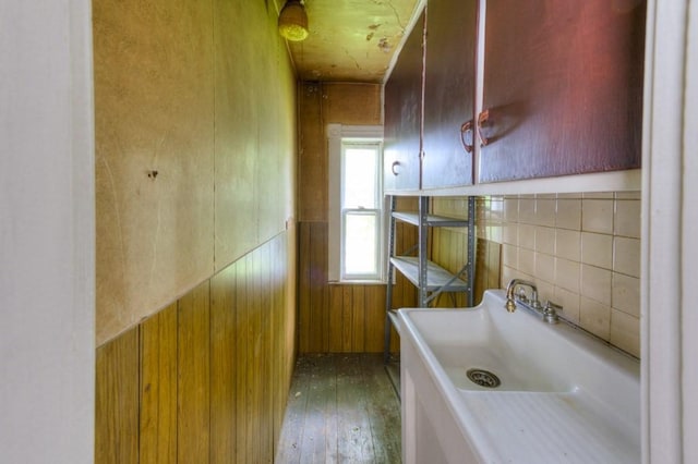 bathroom featuring hardwood / wood-style floors and wainscoting