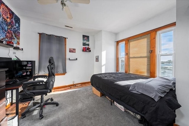 bedroom featuring ceiling fan and carpet floors