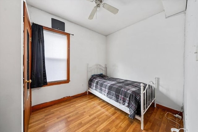 bedroom featuring ceiling fan and hardwood / wood-style floors